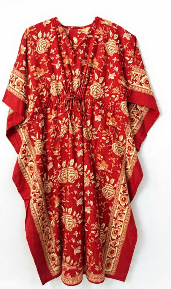 Red dress with gold patterns on a white background