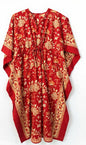 Red dress with gold patterns on a white background
